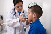 picture of medical doctors  - Medical doctor applying oxygen treatment on a little boy with asthma - JPG 