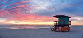 pic of beach  - Miami South Beach sunrise with lifeguard tower and coastline with colorful cloud and blue sky - JPG 