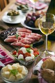 stock photo of food  - Fresh caprese salad on table full of food - JPG 