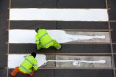 picture of construction worker  - workers painting crosswalk with white colour  - JPG 
