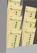 picture of time  - Time cards in a rack for business payroll to pay day hourly wage job - JPG 