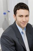 picture of young adult  - Portrait of happy young businessman at office - JPG 