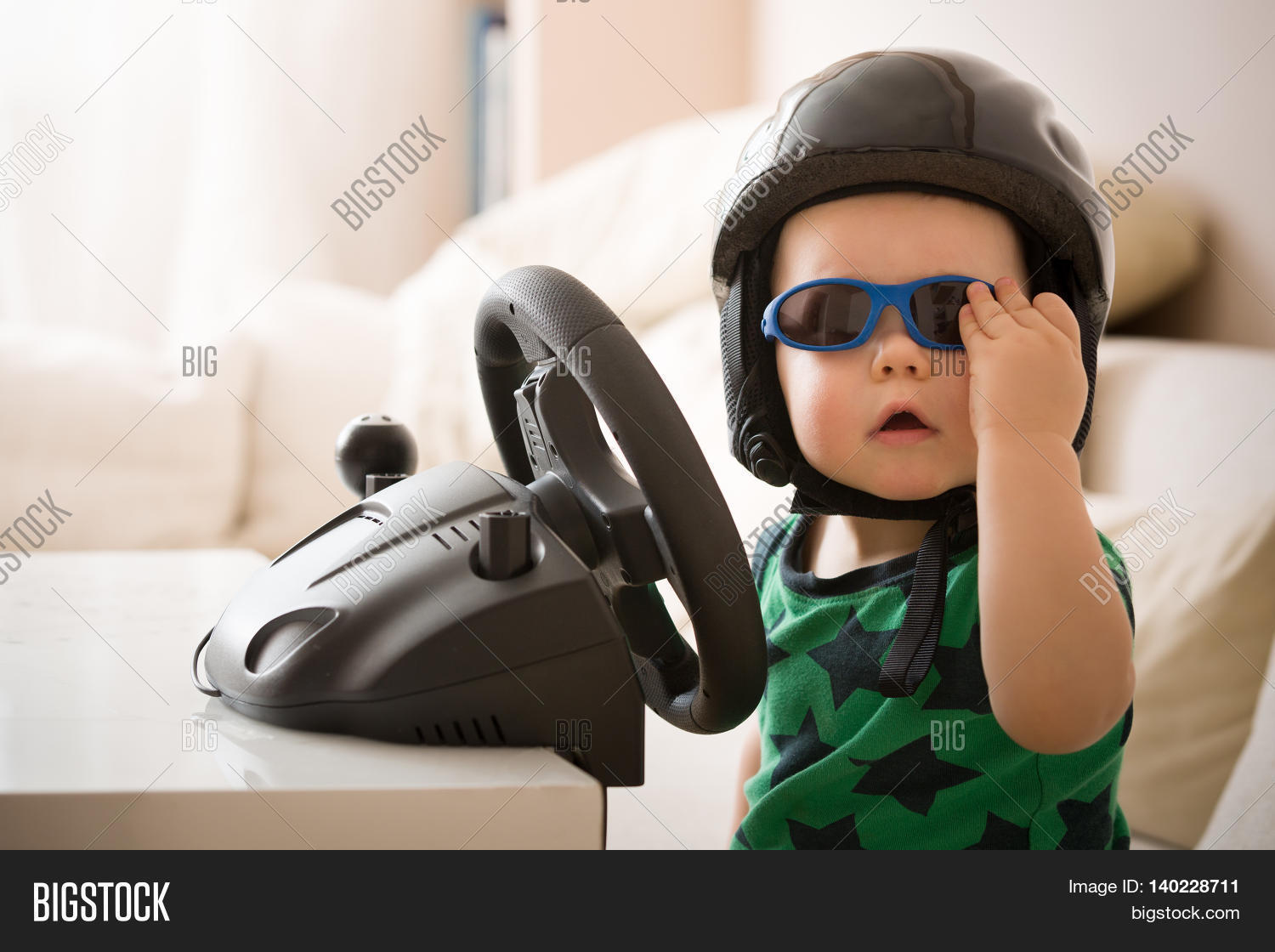 cute little kid boy in a helmet playing with computer steering wheel future driver - Little Kid Pictures cute little kid boy in a helmet playing with computer steering wheel future driver - Little Kid Pictures