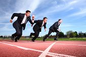 picture of business people  - Businessmen running on track - JPG 