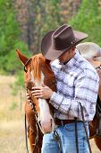 image of horse  - Cowboy working his horse in the field - JPG 