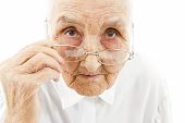 picture of watch  - portrait of a very old woman taking off her glasses - JPG 