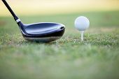 pic of golf  - Closeup of a golf club and a golf ball ready for tee off - JPG 