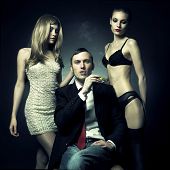 picture of man  - Fashion photo of handsome man and two women - JPG 
