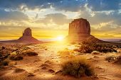 stock photo of valley  - Sunset at the sisters in Monument Valley USA - JPG 