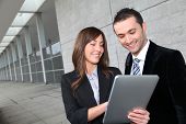 image of meeting  - Business people meeting outside with electronic tablet - JPG 