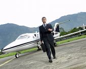 stock photo of businessmen  - Businessman outside his private plane - JPG 
