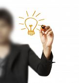 foto of light  - hand with a pen drawing light bulb - JPG 