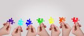 image of puzzle  - Hands and puzzle - JPG 