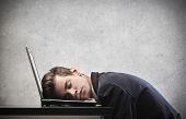 picture of pressure  - Businessman sleeping on his laptop - JPG 