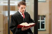 pic of code  - Lawyer with civil law code in a court room - JPG 