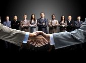 picture of meeting  - handshake isolated on business background - JPG 