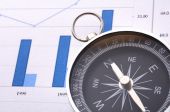 stock photo of business concept  - business concept with compass and diagram or chart - JPG 