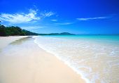 foto of beach  - Beautiful beach with crystal clear blue waters of the Andaman sea against blue sky at Krabi bay - JPG 