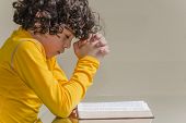 pic of late  - Lating young boy praying and praising God - JPG 