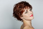 pic of health  - beautiful young woman with red hair wearing short pixie crop hairstyle on studio background - JPG 