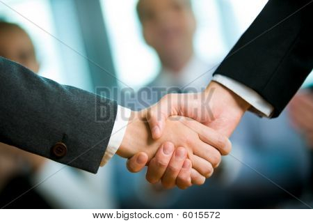 Picture or Photo of Photo of handshake of business partners after striking deal