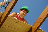 picture of construction worker  - builder construction worker on a new roof - JPG 