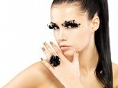 image of black  - Closeup portrait of the beautiful woman with long black false eyelashes makeup and golden nails - JPG 