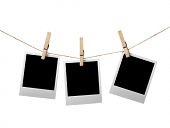 stock photo of insert  - Three blank instant photos hanging on the clothesline - JPG 