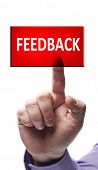 picture of feedback  - Feedback button pressed by male hand - JPG 