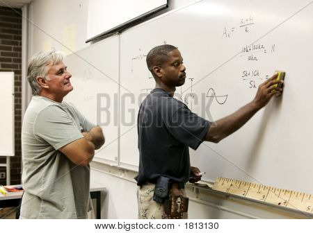 Stock photo : Student Erasing Board