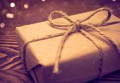 foto of objects  - Gift wrapped in paper in the wooden backgroud - JPG 
