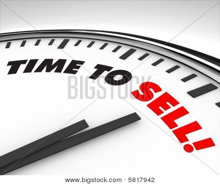 Picture or Photo of White clock with words Time to Sell on its face