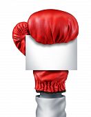 stock photo of competition  - Fight and competition sign with an isolated red boxing glove holding a blank white card as a business symbol of competitive sales or boxing day specials after the christmas holidays isolated on a white background - JPG 