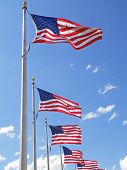 stock photo of blue sky  - Flags blowing in the breeze on a sunny day.
** Note: Slight graininess, best at smaller sizes - JPG 