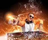 stock photo of mixer  - DJ with a mixer equipment to control sound and play music - JPG 