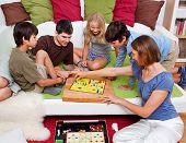 foto of family  - a young family is playing board - JPG 