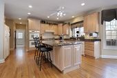 image of interior  - Kitchen in luxury home with oak wood cabinetry - JPG 