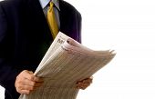 picture of newspaper  - Business man reading business section of newspaper on white background - JPG 