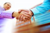 foto of business people  - Shaking hands of two business people - JPG 