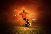 foto of competition  - Football player on the field and fire - JPG 