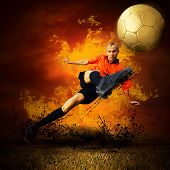 stock photo of competition  - Football player in fires flame on the outdoors field - JPG 