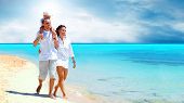 picture of beach  - View of happy young family having fun on the beach - JPG 