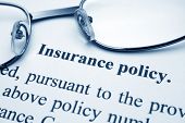image of finance  - Close up of glasses on Insurance policy
 - JPG 