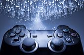 stock photo of game  - Game controller and blue light - JPG 