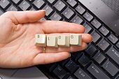 stock photo of business people  - Hand over computer keyboard holding keys that spell blog - JPG 
