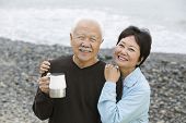 image of beach  - Portrait of a happy and loving mature couple at the beach - JPG 