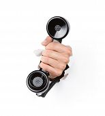 picture of hole  - Male hand holding retro telephone through the hole isolated on white background - JPG 