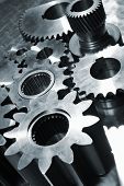image of technology concept  - industrial titanium and steel gear parts all in a metallic blue toning concept - JPG 