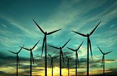 stock photo of sunset  - wind turbine farm over sunset - JPG 