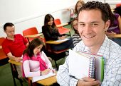stock photo of student  - casual student or teacher in a classroom full of students - JPG 